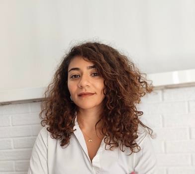 A person with curly hair  AI-generated content may be incorrect.